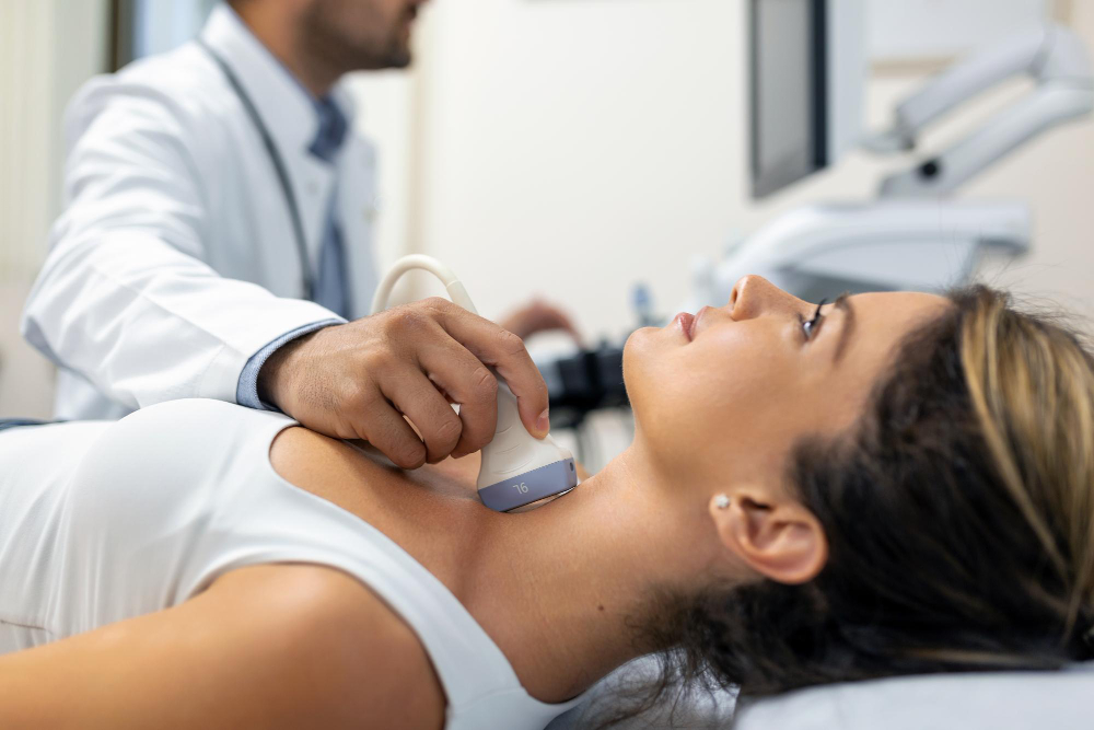 close-up-shot-of-young-woman-getting-her-neck-examined-by-doctor-using-ultrasound-scanner-at-modern-clinic close-up-shot-of-young-woman-getting-her-neck-examined-by-doctor-using-ultrasound-scanner-at-modern-clinic